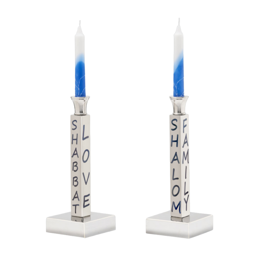The Shabbat Candlestick Set/2 by Inspired Generations features two silver holders, each with blue-and-white candles and blue "SHABBAT" and "SHALOM" inscriptions—ideal for a meaningful, welcoming table setting.