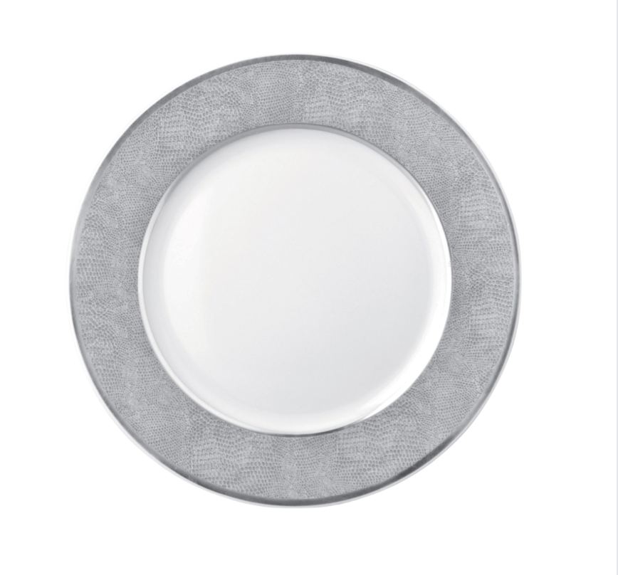The Bernardaud Sauvage Grey & Platinum plate features Limoges porcelain with a round white center and a wide, platinum snake skin–embossed silver-gray rim, displayed on a plain white background.