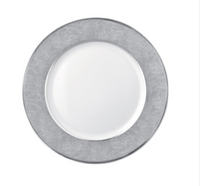 The Bernardaud Sauvage Grey & Platinum plate features Limoges porcelain with a round white center and a wide, platinum snake skin–embossed silver-gray rim, displayed on a plain white background.