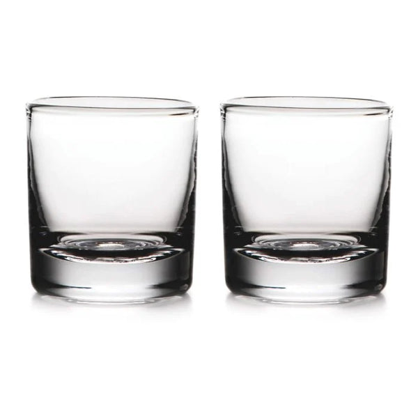 Two empty, clear Simon Pearce Ascutney Double Old Fashioned glasses are placed side by side on a white background, highlighting this elegant set of 2.