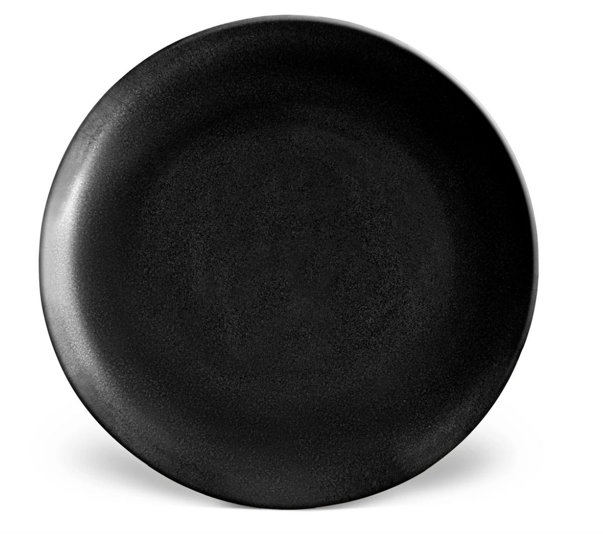 A round, plain black ceramic plate with a subtle matte texture from L'Objet's Terra Iron Dinnerware collection, displayed on a white background.