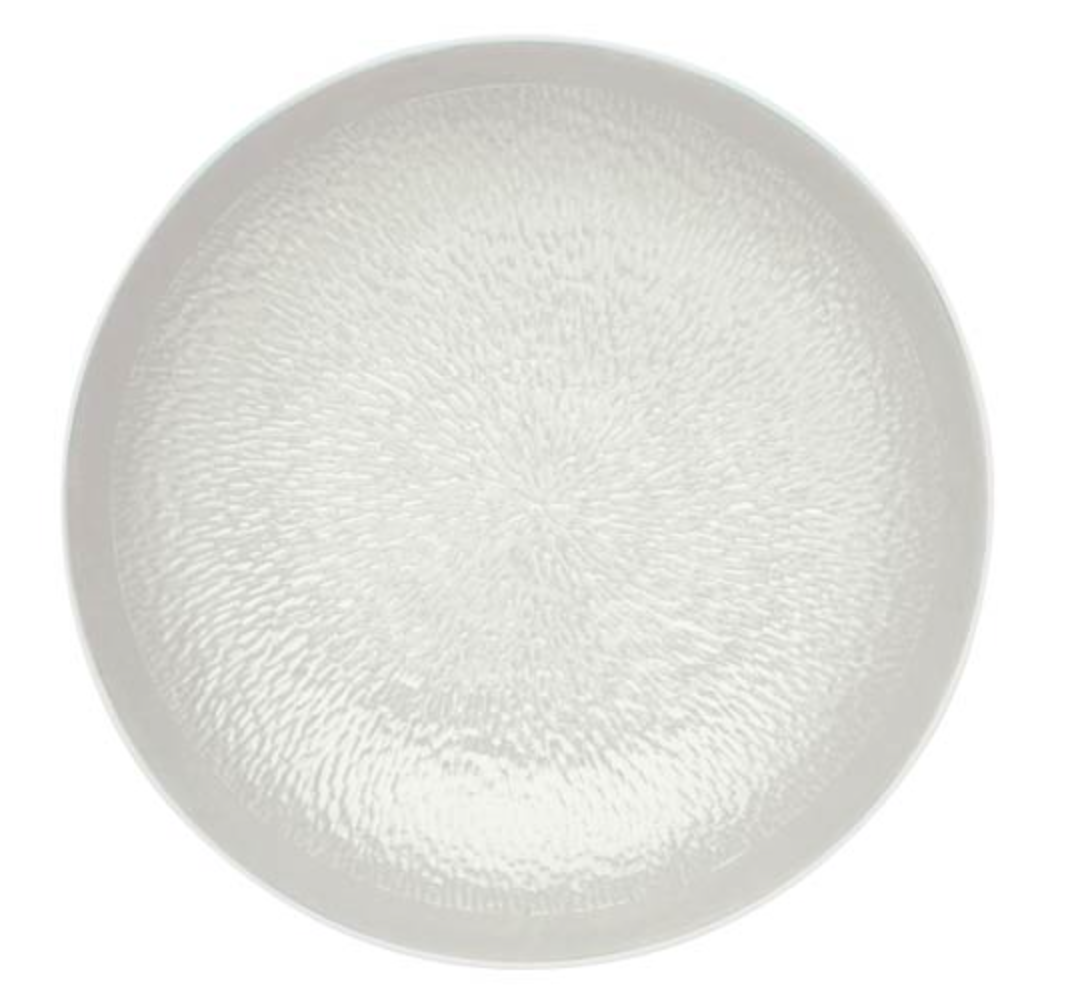 A round, pearl grey Raynaud Mineral Irise porcelain plate features a subtle textured pattern radiating from the center, displayed from a top-down view against a white background.