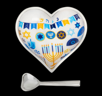 Inspired Generations Hanukkah Heart Bowl with Spoon, a polished aluminum heart-shaped bowl decorated with Hanukkah symbols, stars of David, and a menorah, accompanied by a matching heart-shaped spoon.