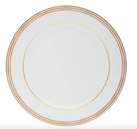 The Royal Limoges Latitudes Dinnerware plate is crafted from white Limoges porcelain with three thin gold rings at the rim, handmade in France and shown on a plain white background.