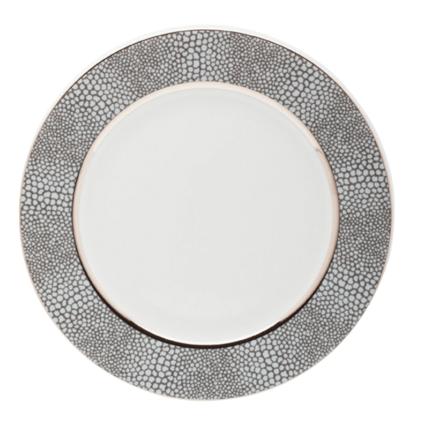 The Makassar Gray & Platinum Dinnerware by Royal Limoges/Bia Cordon Bleu is a round white Limoges porcelain dinner plate, handmade in France, featuring a wide textured gray and silver rim with pebble-like pattern and platinum trim.