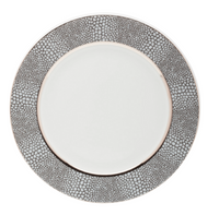 The Makassar Gray & Platinum Dinnerware by Royal Limoges/Bia Cordon Bleu is a round white Limoges porcelain dinner plate, handmade in France, featuring a wide textured gray and silver rim with pebble-like pattern and platinum trim.