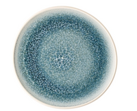 The Rosenthal Junto Aquamarine Dinnerware plate features a round stoneware design with a blue and white crackle glaze gradient radiating from the center and an off-white rim. Dishwasher and microwave safe.