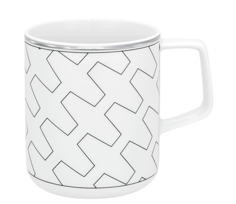 A white ceramic mug with a black geometric pattern, square handle, and thin silver rim—ideal for pairing with Vista Alegre’s Trasso Dinnerware.
