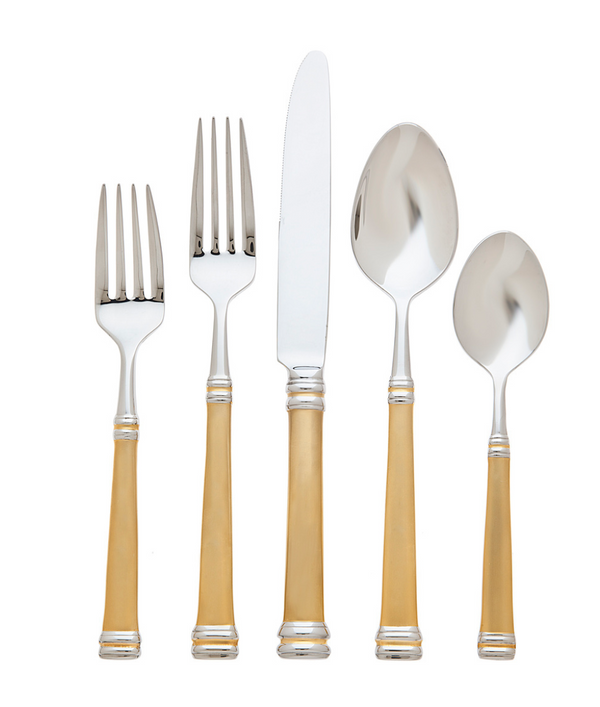 The Ricci Royal Bramasole Gold Flatware 5-Piece Setting, crafted from 18/10 stainless steel with 22k gold-plated handles, features two forks, a knife, a tablespoon, and a teaspoon arranged upright against a white background.