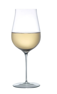 A handmade Ghost Zero Tulip Glassware by Nude Glassware, filled halfway with white wine and isolated on a white background.
