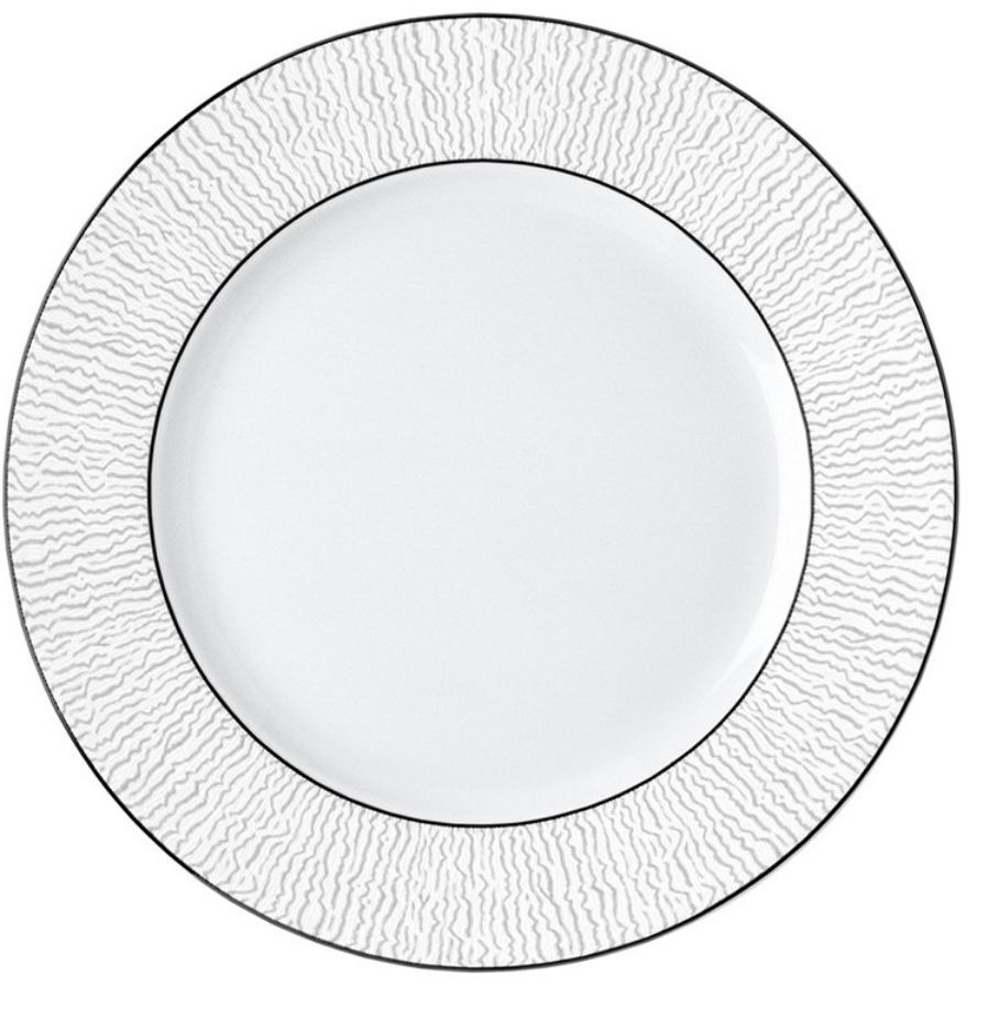 The Bernardaud Dune Dinnerware features a handcrafted white dinner plate with a textured, wavy rim and a thin silver border, inspired by classic Bernardaud designs. The center is plain and smooth for elegant dining.
