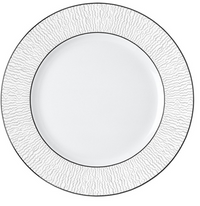 The Bernardaud Dune Dinnerware features a handcrafted white dinner plate with a textured, wavy rim and a thin silver border, inspired by classic Bernardaud designs. The center is plain and smooth for elegant dining.