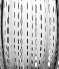 Close-up of a metallic surface with vertical rows of oval holes, reflecting light and dark areas—evoking the refined craftsmanship seen in Zafferano’s Perle Wine Goblet Set of 2.