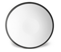 A round, reflective mirror with a black, braided-pattern frame inspired by L'Objet's Soie Tressée Black Dinnerware, photographed against a white background.