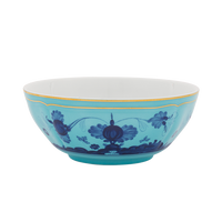The Oriente Italiano Dinnerware Iris by Ginori 1735 is a turquoise ceramic bowl with blue chinoiserie floral motifs and a gold rim, reminiscent of exquisite Italian porcelain.