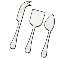 The Be Home Outline Enamel Cheese Set features three elegant utensils—a fork-tipped knife, flat spatula, and pointed spreader—on a white background. Handwash recommended to maintain the enamel finish.
