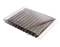 The Apeloig Striped Acrylic Challah Board & Knife | Various is a transparent, rectangular acrylic board featuring multiple compartments and a metal handle across the top.