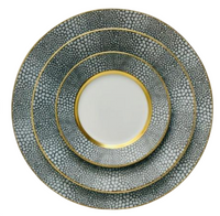 Three round Makassar Gold Dinnerware plates by Royal Limoges, each in a different size, feature white centers, gold rims and filets, and gray pebble-patterned borders with gold accents.