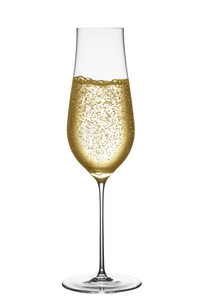 The Ghost Zero Tulip Glassware by Nude Glassware is a tall, slender champagne flute made from lead-free crystal, filled with sparkling golden champagne and rising bubbles, set against a plain white background.