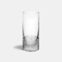 The Richard Brendon Diamond Highball is a clear glass featuring an intricate diamond pattern at the base, exemplifying elegant crystal barware on a plain light gray background.