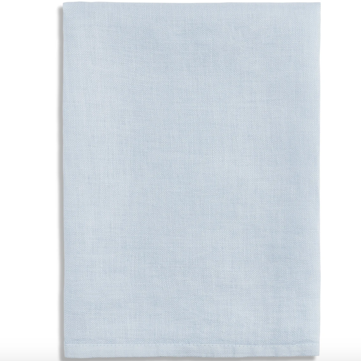 The L'Objet Linen Sateen Napkin Light Blue Set of 4, crafted from 100% linen in Portugal, is shown neatly folded against a white background.