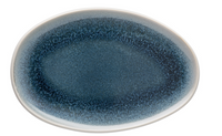 The Rosenthal Junto Aquamarine Dinnerware plate features a large oval stoneware design with a glossy deep blue center fading to lighter blue and white edges, a textured speckled reactive glaze, and is both dishwasher and microwave safe.