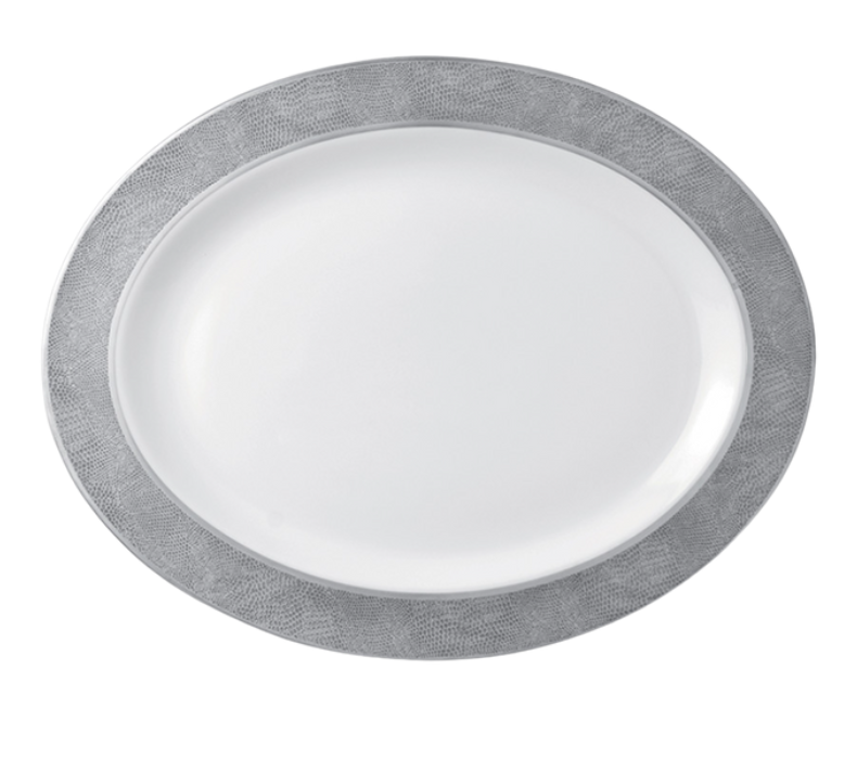 The Bernardaud Sauvage Grey & Platinum plate features a white oval Limoges porcelain center with a wide, snake skin embossed silver-gray rim, shown from above on a plain white background.