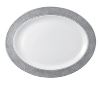 The Bernardaud Sauvage Grey & Platinum plate features a white oval Limoges porcelain center with a wide, snake skin embossed silver-gray rim, shown from above on a plain white background.