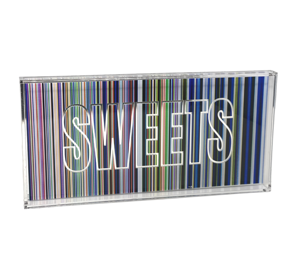 The Stripey SWEETS Tray by Eye Candy features colorful vertical stripes and bold white "SWEETS" lettering—perfect for displaying your favorite sweets, muffins, or cupcakes.