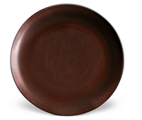 The Terra Wine Dinnerware plate by L'Objet is a round, dark brown handcrafted piece with a subtly textured matte finish, shown against a white background.