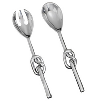 The Knotty Salad Set by Inspired Generations features a handcrafted aluminum fork and spoon with striking decorative knot handles—an elegant, shiny silver duo perfect for stylish salad serving.