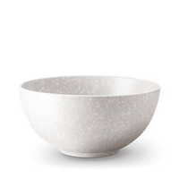 The Alchimie Dinnerware White bowl by L'Objet features a subtle speckled design and is part of our luxury tableware collection, displayed against a plain white background.
