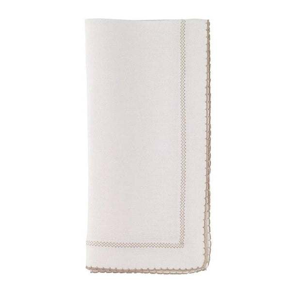 The Bodrum Picot Napkin White & Beige Set of 4 features neatly folded white linen napkins with scalloped beige embroidered borders and decorative stitching near the edge, displayed against a plain white background.