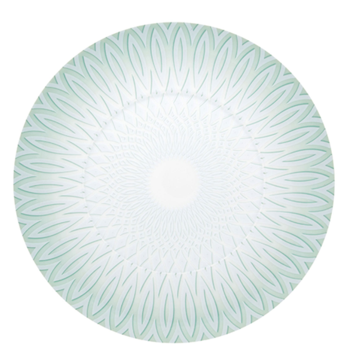 The Venezia Dinnerware by Vista Alegre is a round porcelain plate featuring a geometric, petal-like pattern in light green and white that radiates from the center to the edge.