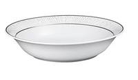 The Dune Dinnerware by Bernardaud is a white, shallow Limoges porcelain bowl featuring a textured, leaf-inspired pattern and a slim black rim, displayed on a plain white background.