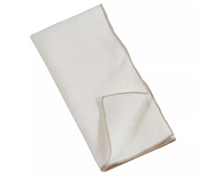 The Stitch Stone Ivory Washed Napkin Set of 4 by Saro Trading features neatly folded white napkins accented with light brown trim along the edges, displayed on a plain white background—their clean finish evoking the look and feel of premium linen table settings.