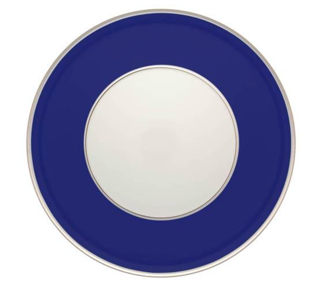 The Vista Alegre Harvard Dinnerware plate features a round porcelain design with a white center, a wide dark blue border, and a thin gold rim inspired by classic New England style.