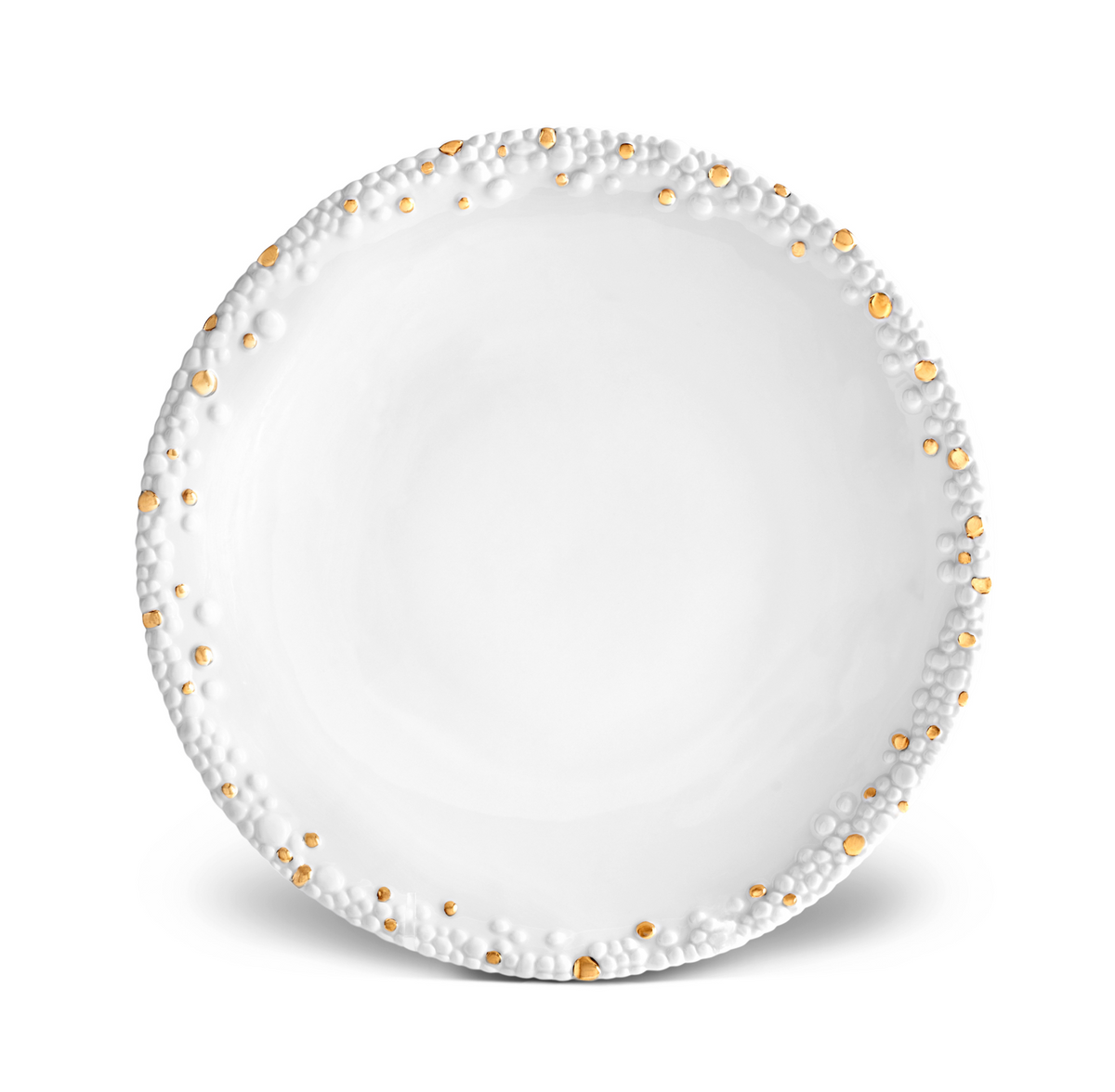The Haas Mojave Dinnerware Gold plate from L'Objet is a round, white ceramic piece featuring a textured rim with raised bumps and subtle gold accents along the edge, shown on a white background.