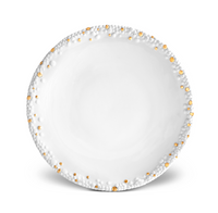 The Haas Mojave Dinnerware Gold plate from L'Objet is a round, white ceramic piece featuring a textured rim with raised bumps and subtle gold accents along the edge, shown on a white background.