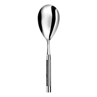 The Conty Large Serving Spoon Grey by Capdeco is a French-made, stainless steel serving spoon with a polished oval bowl and a straight handle accented in gray with metallic ends, shown on a white background.