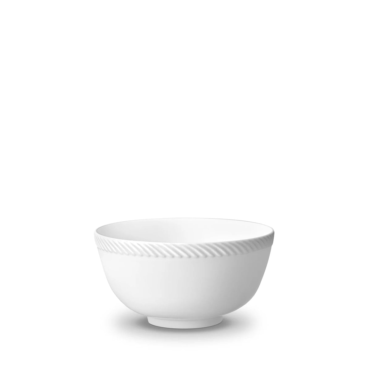 The Corde White Dinnerware by L'Objet features a fine porcelain bowl with a subtle, textured stripe near the rim, shown against a white background.