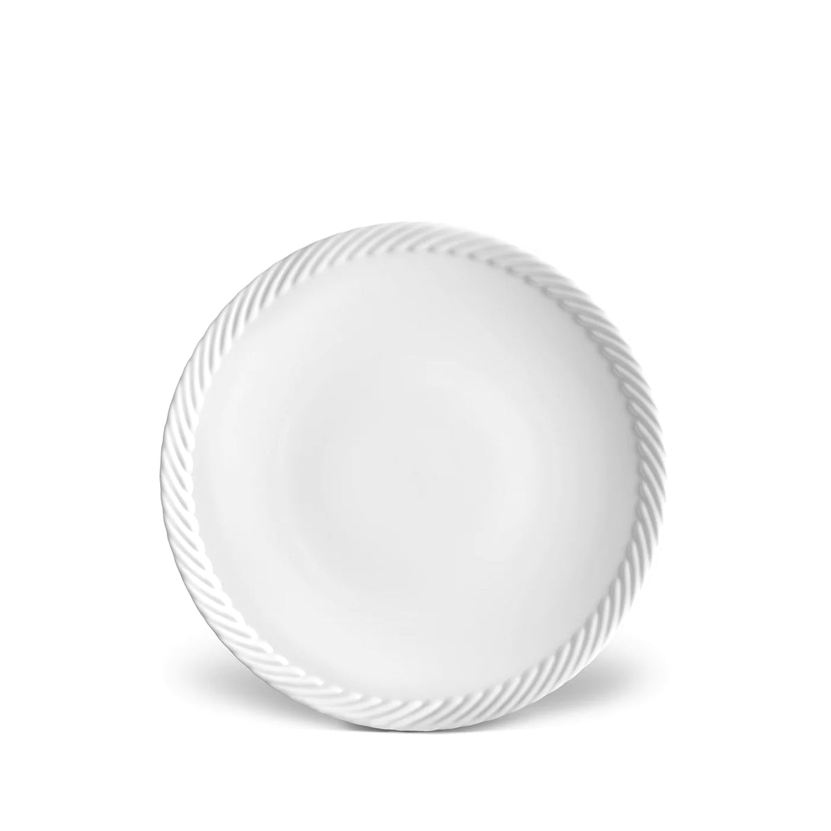The Corde White Dinnerware by L'Objet features a fine porcelain plate with a subtle, embossed spiral pattern along the rim against a crisp white background.