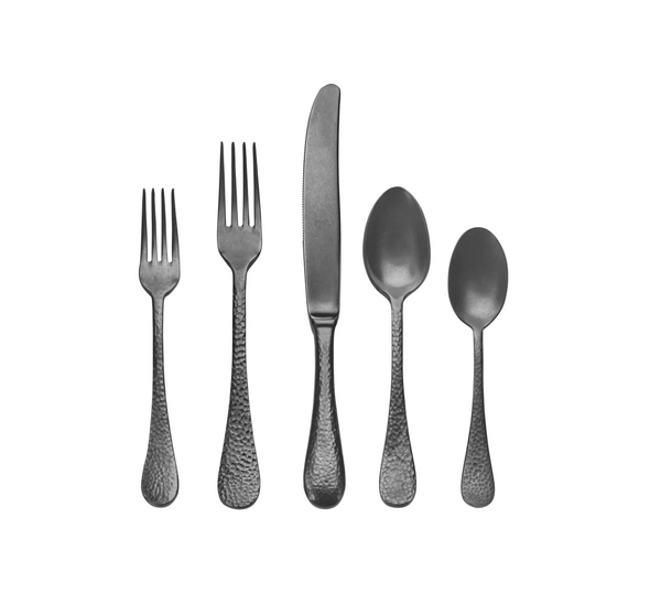 The Mepra Epoque Oro Nero Flatware 5 Piece Setting features black stainless steel pieces with a textured finish, including two forks, a knife, and two spoons of varying sizes displayed in a row against a white background.