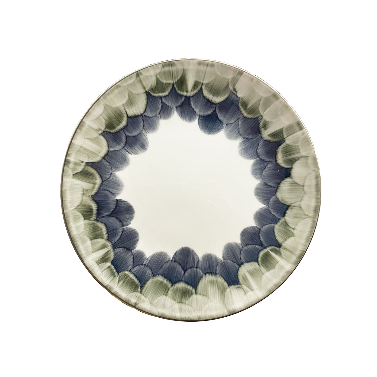 The Marie Daâge Cercle d'Ecailles Dessert Plate features a white center and a rim decorated with hand-painted green and blue brushstroke patterns—a refined Limoges porcelain piece by Marie Daâge.