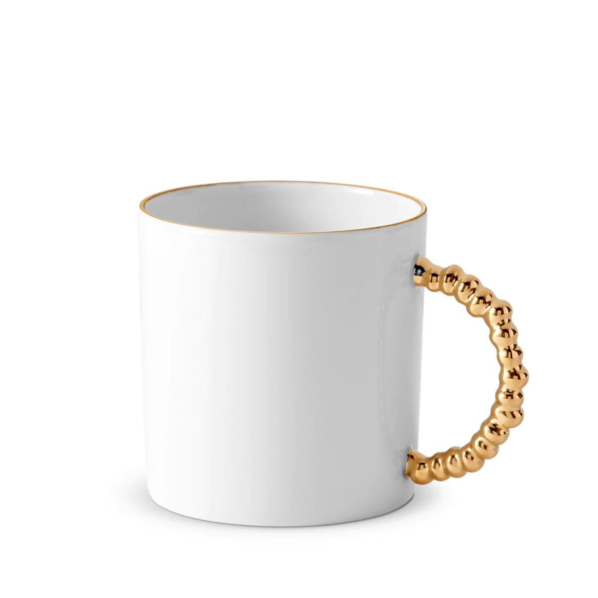 The L'Objet Haas Mojave Dinnerware Gold mug features fine white porcelain, a shiny gold beaded handle, and a thin gold rim, reflecting the signature elegance of the Haas Brothers collection.