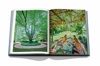 The Hamptons Private by Assouline features an open book with a leafy tree on one page and people dining outdoors under a pergola on the other, capturing a summer vacation vibe inspired by The Hamptons.