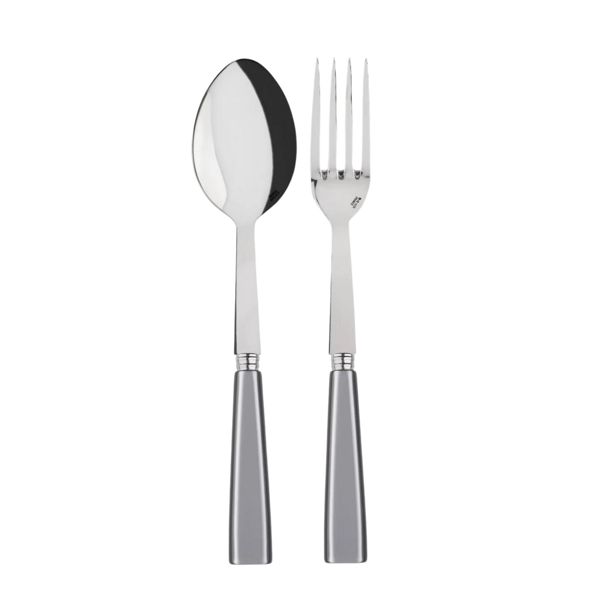 A Sabre Icone Serving Set, featuring a shiny metal spoon and four-pronged fork with matching silver handles, is displayed side by side on a white background.