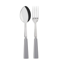 A Sabre Icone Serving Set, featuring a shiny metal spoon and four-pronged fork with matching silver handles, is displayed side by side on a white background.