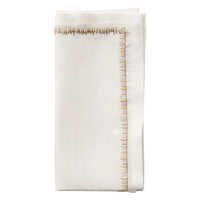 The Kim Seybert Filament Napkin Gold & Silver Set of 4 features elegant white embroidered linen with decorative metallic stitching—ideal for enhancing your festive table setting.