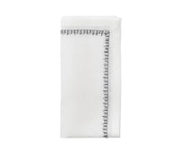 The Kim Seybert Filament Napkin White & Gunmetal Set of 4 features elegant white linen napkins with a decorative gunmetal stitched border—perfect for festive or sophisticated tables.